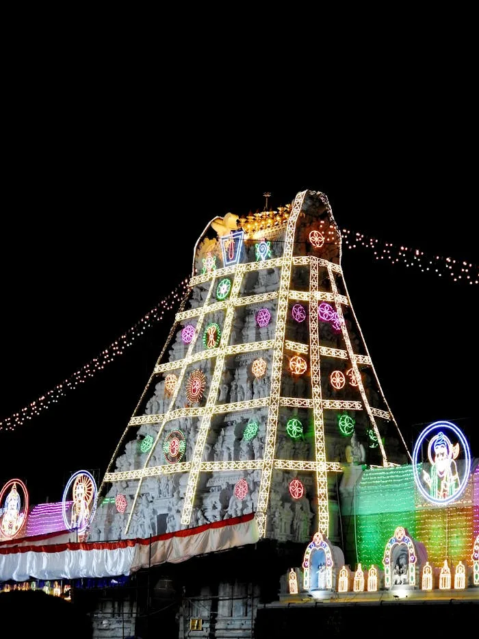 Tirumala gopuram with Lights Vibrant night view of the illuminated Tirumala Temple adorned with festive lights.